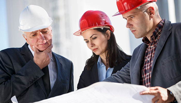 Engineers looking at plan